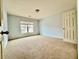 Cozy bedroom with plush carpeting, a window overlooking the exterior, and a closet at 3740 Crowchild Dr, Cumming, GA 30041