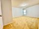 Neutral bedroom featuring plush carpeting, a single window, and ample space at 3740 Crowchild Dr, Cumming, GA 30041