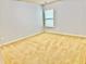 Empty carpeted bedroom featuring a single window and neutral color palette at 3740 Crowchild Dr, Cumming, GA 30041