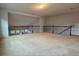 Large open bonus room with neutral carpeting and staircase railing at 3740 Crowchild Dr, Cumming, GA 30041