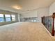 Large loft provides an abundance of natural light, plush carpeting, and decorative iron railings at 3740 Crowchild Dr, Cumming, GA 30041