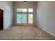 Bright and airy main bedroom with neutral paint, carpeting and large windows at 3740 Crowchild Dr, Cumming, GA 30041