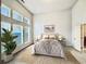 Sun-filled main bedroom with large windows, a neutral palette, and a serene atmosphere at 3740 Crowchild Dr, Cumming, GA 30041