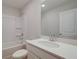 Bright bathroom featuring a shower-tub combo, white vanity and new faucet at 409 Carrera Ln, Acworth, GA 30102