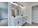 Bathroom showcasing double vanity, black fixtures, and access to a closet at 409 Carrera Ln, Acworth, GA 30102