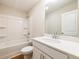 Bright bathroom featuring a clean bathtub, white vanity with marble countertop, and neutral walls at 409 Carrera Ln, Acworth, GA 30102