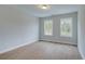 Bedroom with neutral color palette, luxury vinyl plank floors, and double windows at 409 Carrera Ln, Acworth, GA 30102