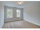 Bedroom with wood-look flooring and two windows at 409 Carrera Ln, Acworth, GA 30102