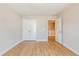 Bedroom with hardwood floors, closet, and white trim at 409 Carrera Ln, Acworth, GA 30102