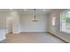 Bright dining room featuring an elegant chandelier, wood-look flooring and lots of space at 409 Carrera Ln, Acworth, GA 30102