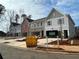 Community street view of new construction townhomes with drive under garages at 409 Carrera Ln, Acworth, GA 30102