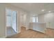 Hallway with wood floors provides access to several rooms and closets, showcasing the home's functional layout at 409 Carrera Ln, Acworth, GA 30102