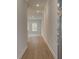 Inviting hallway featuring luxury vinyl plank flooring, neutral paint and natural lighting at 409 Carrera Ln, Acworth, GA 30102