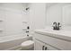 Bright bathroom featuring white cabinetry, a shower-tub combo, and modern fixtures at 420 Carrera Ln, Acworth, GA 30102