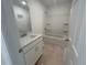 Bathroom featuring a bathtub, shower combo, and modern vanity with white cabinets at 420 Carrera Ln, Acworth, GA 30102