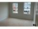 Light-filled bedroom featuring double hung windows and neutral walls at 420 Carrera Ln, Acworth, GA 30102