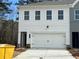 Charming two-story home with white siding, a two-car garage, and a well-manicured lawn at 420 Carrera Ln, Acworth, GA 30102