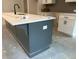 Close-up of a kitchen island with white countertop and gray base cabinets in a new home at 420 Carrera Ln, Acworth, GA 30102