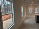 Open living room with neutral walls and many windows at 420 Carrera Ln, Acworth, GA 30102