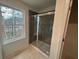 Modern bathroom featuring gray tile shower with glass doors at 420 Carrera Ln, Acworth, GA 30102