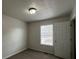 Cozy bedroom featuring neutral walls, carpeted flooring, and a window with blinds for natural light at 47 Brushy Mountain Way, Rockmart, GA 30153