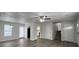 Open-concept living area with new floors, fresh paint, and modern lighting at 47 Brushy Mountain Way, Rockmart, GA 30153