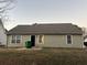 View of backyard with black door and beige siding at 4735 Jackam Ridge Ct, Lithonia, GA 30038