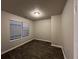 Bedroom featuring wood-look floors, neutral paint, and a large double-hung window with bright, natural light at 4735 Jackam Ridge Ct, Lithonia, GA 30038