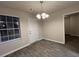 Dining room with new light fixture and natural light at 4735 Jackam Ridge Ct, Lithonia, GA 30038