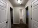 Hallway with access to a bright bathroom and a bedroom and hard wood floors at 4735 Jackam Ridge Ct, Lithonia, GA 30038