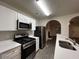 Well-lit kitchen with stainless steel appliances and white cabinetry at 4735 Jackam Ridge Ct, Lithonia, GA 30038