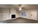 Spacious living area features a fireplace with built-in shelving, and wood-look floors for modern comfort at 4735 Jackam Ridge Ct, Lithonia, GA 30038