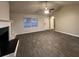 Inviting living area with wood-look flooring, white trim, and a view of the entry door and large window at 4735 Jackam Ridge Ct, Lithonia, GA 30038