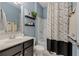 Bathroom features a black and white patterned shower curtain and blue walls at 2279 Larkspur Run Dr, Duluth, GA 30097