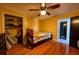 Bedroom with hardwood floors, closet, and access to other rooms at 5332 Audubon Pl, Norcross, GA 30093