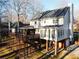 Rear exterior view showcasing a large deck and a screened porch, enhancing outdoor living at 2120 Chartwell Ct, Lawrenceville, GA 30043