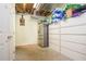 Unfinished basement area with a compact refrigerator and ample storage cabinets, great for organization at 6435 Ivey Creek Cir, Cumming, GA 30040