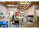 Spacious unfinished basement with natural light, offering potential for a workshop or storage area at 6435 Ivey Creek Cir, Cumming, GA 30040