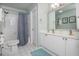 A light and airy bathroom featuring a double sink vanity and a shower/tub combo at 6435 Ivey Creek Cir, Cumming, GA 30040