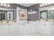 Bright bathroom featuring a garden tub, dual sinks, and a unique stained-glass window at 6435 Ivey Creek Cir, Cumming, GA 30040