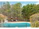 Enjoy the community playground and pool in a serene setting surrounded by trees at 6435 Ivey Creek Cir, Cumming, GA 30040