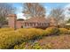 A brick sign that reads 'Ivey Manor' with landscaping in the foreground, welcomes you to the community at 6435 Ivey Creek Cir, Cumming, GA 30040