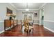 Elegant dining room with hardwood floors and traditional-style furniture at 6435 Ivey Creek Cir, Cumming, GA 30040