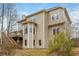 Rear exterior view of the two-story home, showcasing the deck, bay window, and neutral siding at 6435 Ivey Creek Cir, Cumming, GA 30040
