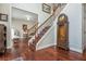 Grand foyer with hardwood floors, staircase, and decorative accents at 6435 Ivey Creek Cir, Cumming, GA 30040