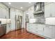 Spacious kitchen features stainless steel appliances, granite countertops and white cabinets at 6435 Ivey Creek Cir, Cumming, GA 30040