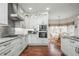 Bright kitchen with stainless appliances, custom cabinets, and breakfast nook at 6435 Ivey Creek Cir, Cumming, GA 30040