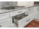 Modern kitchen featuring a gas stovetop and storage drawer at 6435 Ivey Creek Cir, Cumming, GA 30040