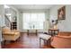 Comfortable seating area with vintage furnishings and natural light streaming through window at 6435 Ivey Creek Cir, Cumming, GA 30040