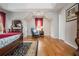 Bright primary bedroom featuring hardwood floors, an area rug, and large windows at 6435 Ivey Creek Cir, Cumming, GA 30040